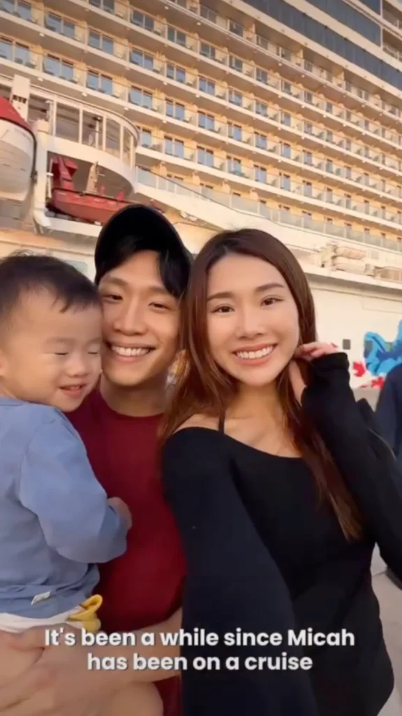 Family with a toddler smiling together in front of a cruise ship, captioned 'It's been a while since Micah has been on a cruise