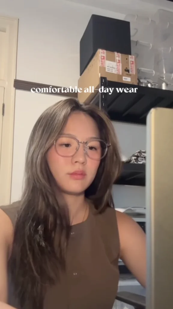 Close-up of woman wearing clear Owndays eyeglasses at home, showcasing comfortable all-day wear for Owndays campaign